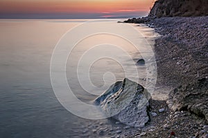 After Sunset, Boulders in the Calm Sea