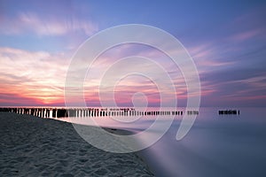 Sunset and breakwaters on the Baltic Sea