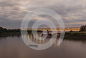 Sunset with a bridge leading over Thanlyin river in Hpa An, Myanmar