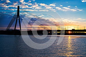 Sunset bridge river Daugava Riga