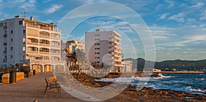 Sunset on the Cafes on Ibiza beaches. Golden glow as the sun goes down in St Antoni de Portmany Balearic Islands, Spain