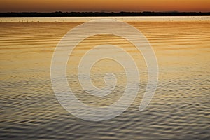 Sunset on calm lake