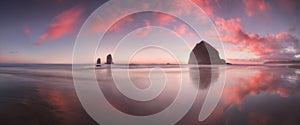 The Sunset at Cannon Beach with Dramatic clouds in the background and a nice reflection in water. Dramatic coastal seascape.