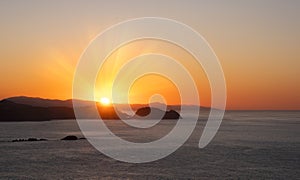 Sunset in the Cantabrian Sea, coast of Gipuzkoa with the sun hiding behind Getaria.