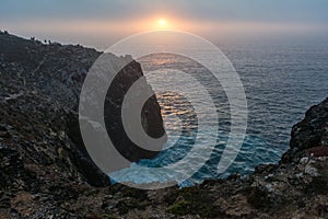 Sunset at the cape of San Vicente in Portuguese Cabo de SÃÂ£o Vicente located in the southwestern tip of Portugal. It is located photo