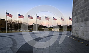 Sunset captured behind the circle of flags at the Washington Monument