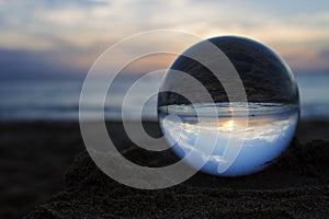 Sunset Captured in Glass or Crystal Ball on Beach