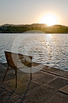 Sunset with chair near lake