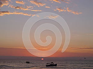 Sunset in Chorrillos district of Lima waters.