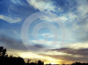 Sunset with cirrus clouds and Saharan dust in the air