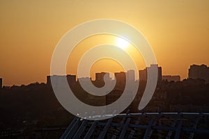 Sunset and cityscape. Bird`s eye view of downtown at dusk