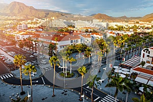 sunset cityscape of Playa de las Americas holiday resort streets in Tenerife. Canary islands