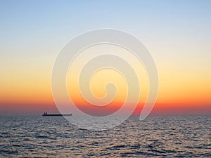 Sunset on a clear sky at sea