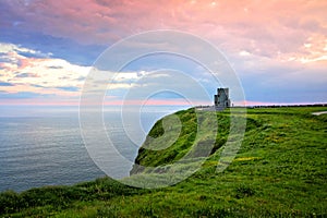 Sunset at the Cliffs of Moher with O`Brien`s Tower, Ireland