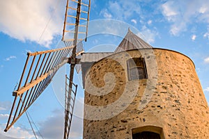 Sunset close up view of old windmill. Porquerolles island, France.