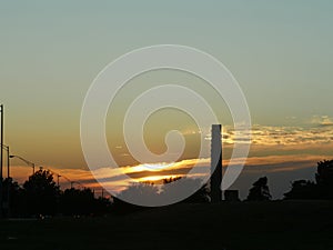 Sunset clouds above the tree silhouettes