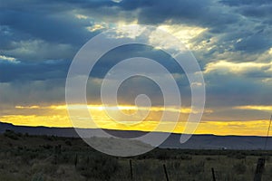 Sunset clouds on a desert mountain