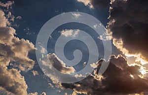 Sunset with clouds, light rays and atmospheric effect