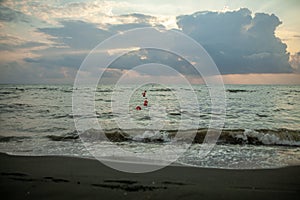 Sunset with clouds, light rays and other atmospheric effect. Dramatic cloudy skyline