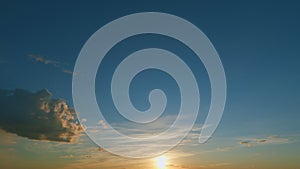 Sunset with clouds in motion. Summer sky at sunset with cirrocumulus clouds. Timelapse.