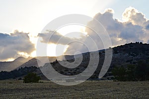 Sunset, clouds and mountains