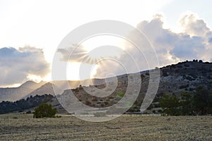 Sunset, clouds and mountains