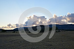 Sunset, clouds and mountains