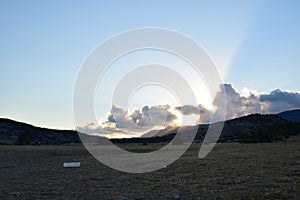 Sunset, clouds and mountains