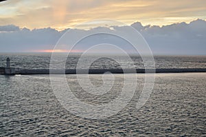 Sunset with clouds over Ocean oastell calm background