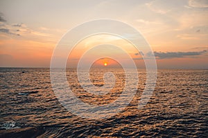 Sunset and Clouds over the Ocean,Woman watching the sun set