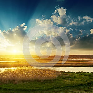 Sunset with clouds over river