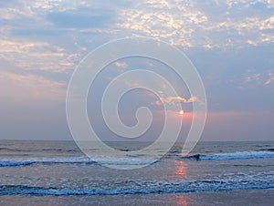 Sunset, Clouds and Reflection in Sea water - Payyambalam Beach, Kannur, Kerala, India