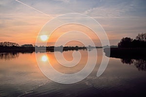 Sunset and clouds in the sky over a Polish lake.