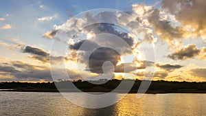 Sunset on a cloudy day at the lake