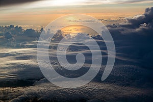 Sunset cloudy sky view from airplane window