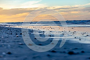 Sunset on coastal landscape from bottom perspective