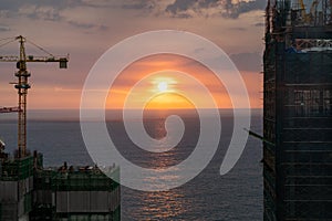 Sunset in Colombo Sri Lanka, with cityscape views of high rise buildings under construction