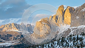 Sunset colored mountain cliff in Alpine valley