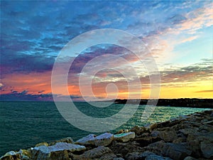 Sea, sunset and colours in Civitanova Marche, Italy. Fascination, attraction and romantic atmosphere