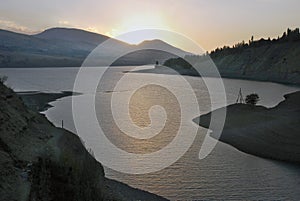 Sunset and contre on the Charvak reservoir photo