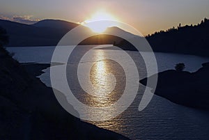 Sunset and contre on the Charvak reservoir photo