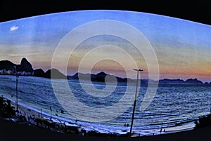 Sunset on Copacabana beach, composing with the Sugar Loaf a beautiful and different image photo