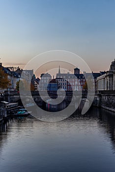 Sunset in Copenhagen on an old canal with boats and houses reflecting in the calm waters - 4