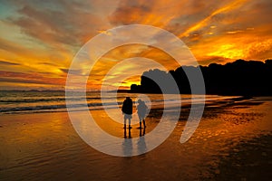 Sunset couple on the beach