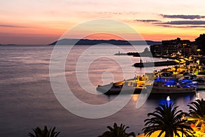 Sunset in croatian resort Podgora, last beams of sun photo