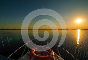 Sunset in the Danube delta Romania.Beautiful blueish lights in water.Beautiful sunset landscape from the Danube Delta Biosphere Re