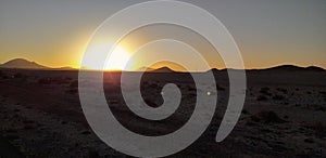 Sunset in desert with volcans