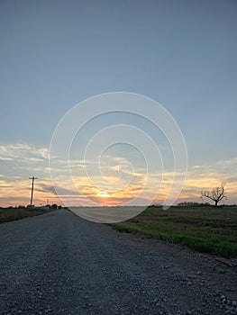 Sunset dirt road Oklahoma clouds