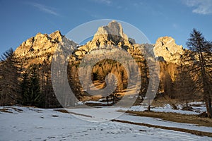 Sunset in the Dolomites, Italy. The peaks are illuminated by the setting sun. Winter landscape mountains in Italian dolomites.