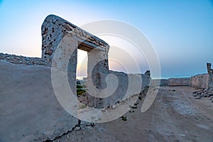 Sunset through the door of a old house in a abandoned fishing village, Qatar